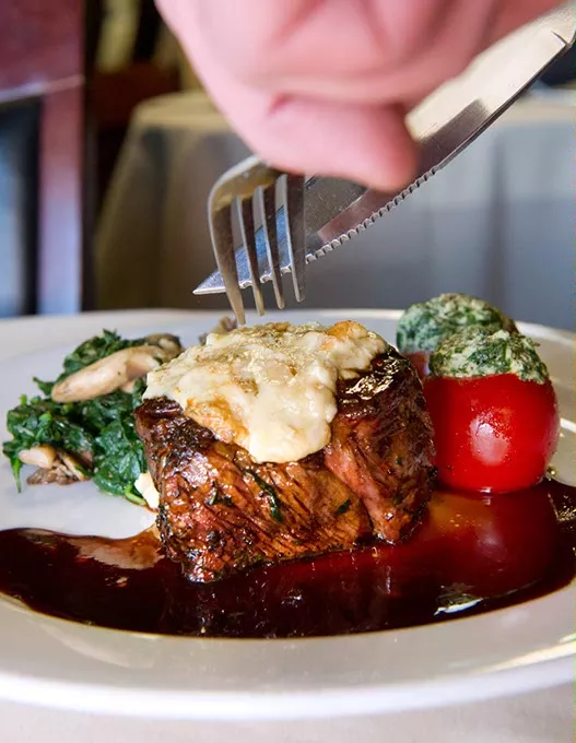 8oz beef tenderloin w smoked bleau cheese and cab sauv wine reduction. stuffed tomato w goat cheese and spinach w grilled oyster mushrooms.