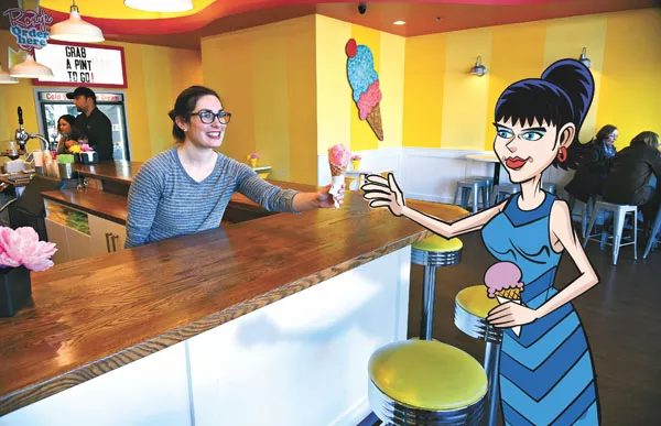 Raena Mutz, owner of Roxy's Ice Cream Social, serves up a strawberry cone, in the Plaza District, 1-26-16. - MARK HANCOCK