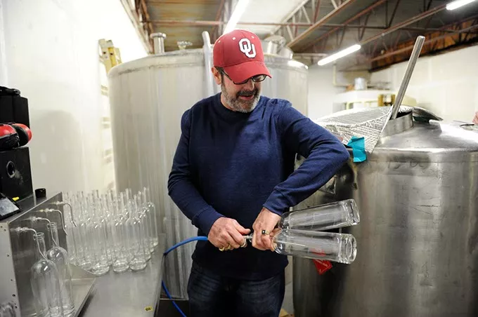Jeff Thurmon gives a tour of Success Vodka, showing the bottling process, in Moore, Thursday, Feb. 5, 2015. - GARETT FISBECK