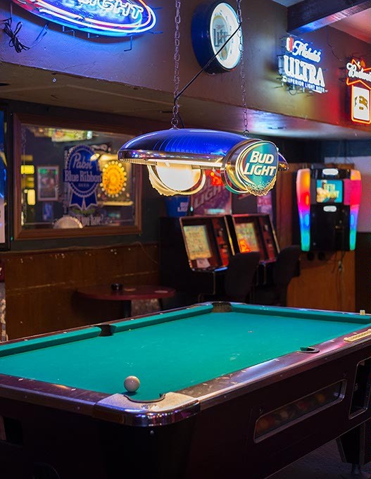 Cue ball sits on pool table at By George bar on Monday, July 7, 2016 in Oklahoma City. - EMMY VERDIN