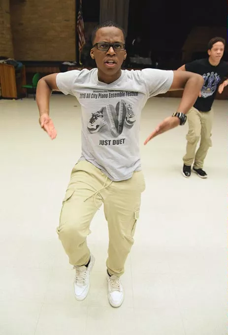 Jason Watts (Eagle Eye) performs with Brothers of Stomp during a demonstration of their step routines at Star Spencer High Schoo. (Mark Hancock / for Oklahoma Gazette)