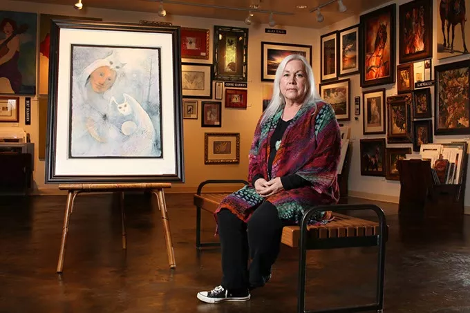 Connie Seabourn poses at 50 Penn Place Gallery, Tuesday, May 16, 2017. The painting shown will be featured in her new exhibit, The Feminine Face of God, held at Oklahoma City University's Hulsey Gallery. - CARA JOHNSON
