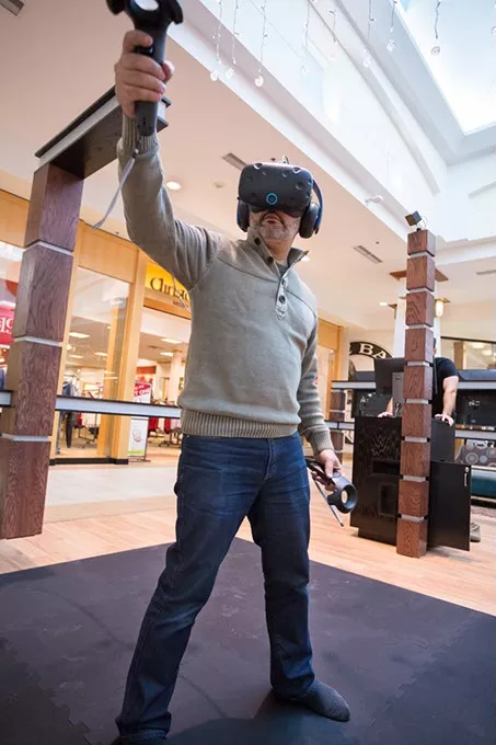 Tarek Dina, co-owner of Immersion House Virtual Reality Store opening in Sooner Mall demonstrates Virtual Games on Tuesday, December 6, 2016 in Oklahoma City. - PHOTOS BY EMMY VERDIN