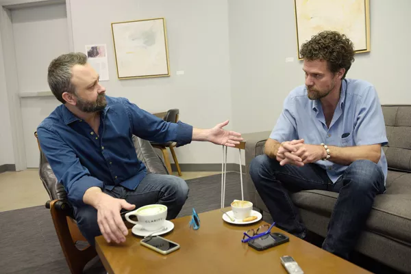 Chad Reynolds and Timothy Bradford talk about their work with Downtown Oklahoma City printing poems on sidewalks at Clarity Coffee, Monday, April 10, 2017. - GARETT FISBECK