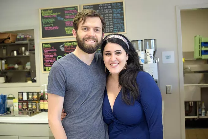 Alex Hall and ranna Bigdely pose for a photo at Paisley Cafe in Norman, Friday, March 24, 2017. - GARETT FISBECK