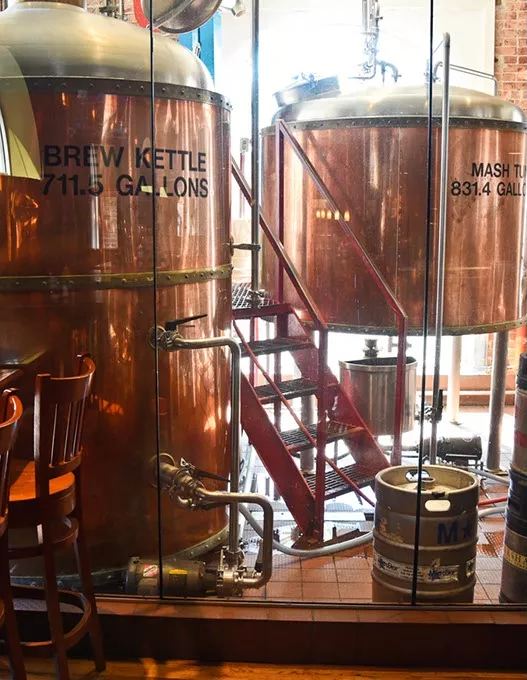 Brewing vesels behind glass at Bricktown Brewery. mh
