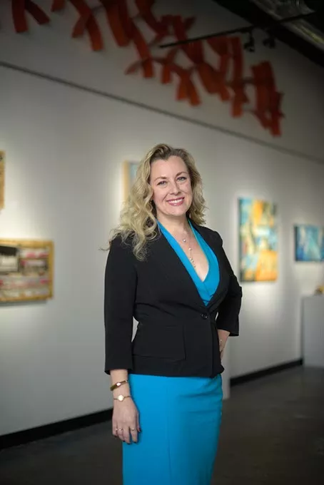 Kendra Horn, executive director of Women Lead, poses for a photo at Kasum Contemporary Fine Art, Wednesday, March 8, 2017. - GARETT FISBECK