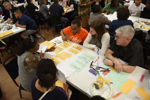 Community members discuss hopes and concerns during an April 5 charter school expansion - meeting at Fairview Missionary Baptist Church. | Photo Garett Fisbeck