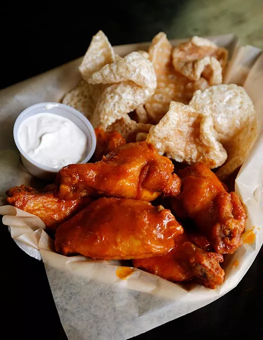 Sriracha hot wings and ghost pepper pork rinds at Knucks Wheelhouse in Oklahoma City, Friday, April 17, 2015. - GARETT FISBECK
