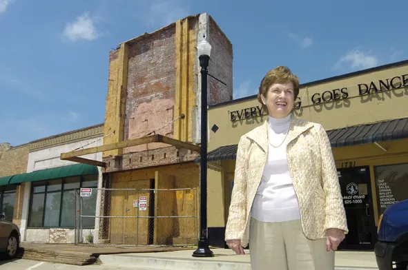 In 2007, Paula Stover looks out over the Plaza District with Lyric Theatre’s front facade under renovation in the background. | Photo Gazette / file