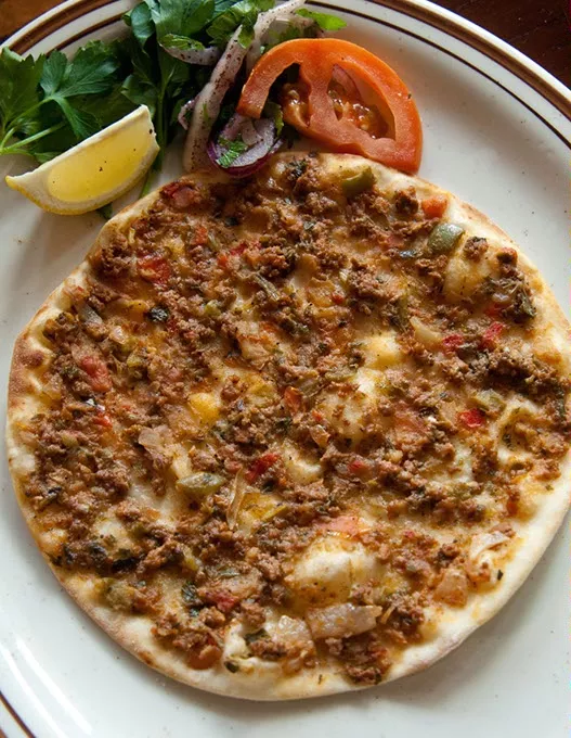 A single serving of Turkish pizza fresh baked at Istanbul Restaurant. mh