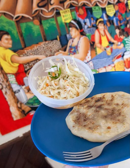 At El Buen Gusto the specialty is pupusas. This one is the revueltas served with cabage and peppers and two sauces. mh