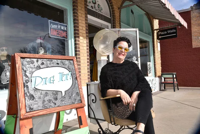 Amanda Martinez relaxes outside her store Dig It! in the 16th Street Plaza District, one of the city’s most popular districts. (Photo Laura Eastes)