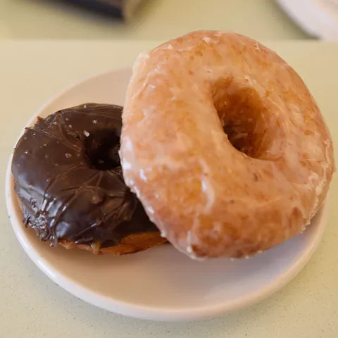 The new location brings fried doughnuts like from right the vanilla bean yeast doughnut and salted chocolate caramel doughnut to the Paseo. (Photo Jacob Threadgill)
