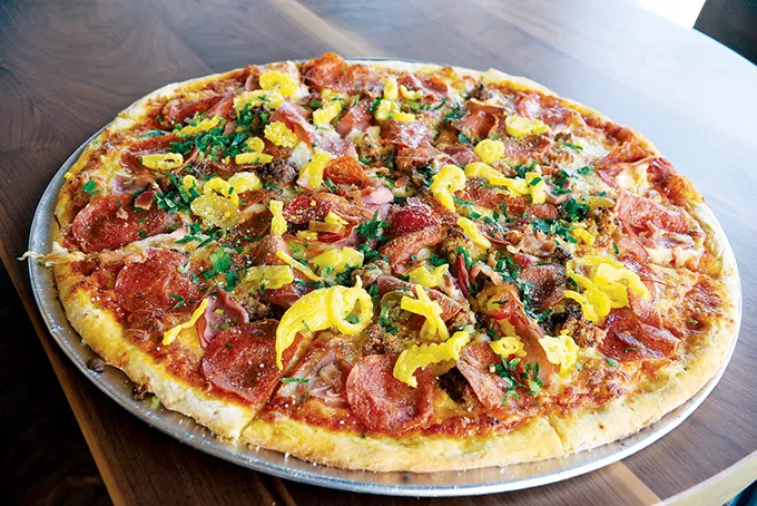 The Guido’s Speedo pizza is topped with crushed meatballs, fried pepperoni, two types of bacon and Italian peppers. - KIMBERLY LYNCH