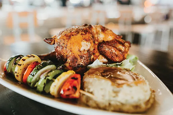 Smoked beer can chicken is one of the most popular items at Industry Gastro Lounge. - ALEXA ACE