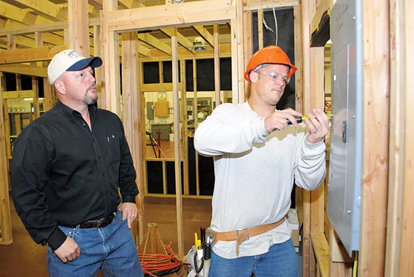 A student works with his teacher at a CareerTech center. - CAREERTECH / PROVIDED