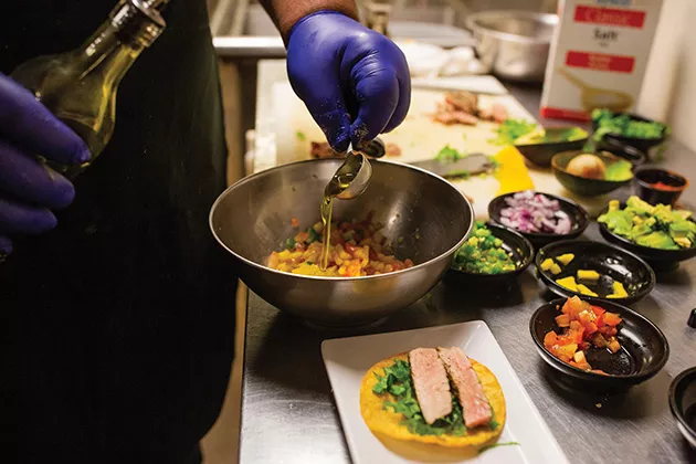 Mango salsa is made with cannabis-infused chili oil for an extra kick. - ALEXA ACE