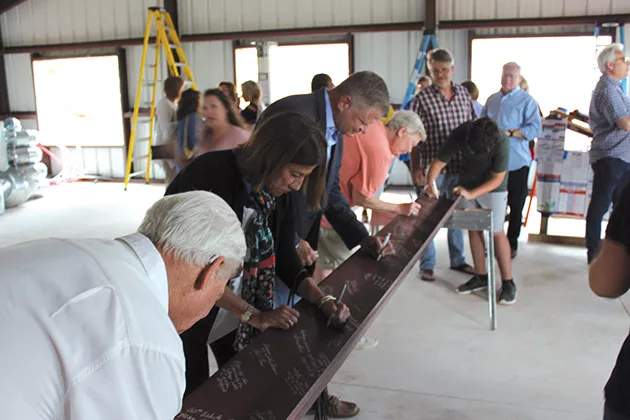 OKC Metro Alliance hosted a beam signing for Women’s Firstep’s new kitchen and dining room being built with funds from the Impact Oklahoma grant. - PROVIDED