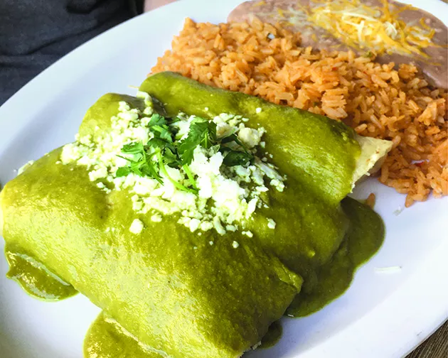 Chicken enchiladas with a poblano and sour cream sauce - JACOB THREADGILL
