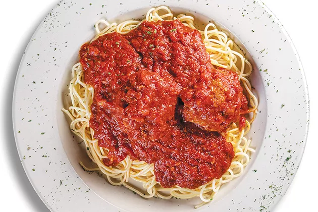 Meatballs and tomato gravy served over spaghetti - PHILLIP DANNER