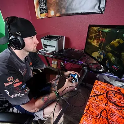 Johnny &#147;Icychiller&#148; Weaver plays Halo at his home in Wellston. (Photo by Garett Fisbeck) (Garett Fisbeck)