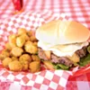 The French Brie Cheeseburger topped with crispy apples and a special sauce and a side of fried okra. The French Brie Cheeseburger topped with crispy apples and a special sauce and a side of fried okra.