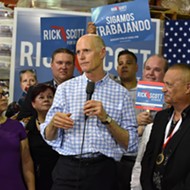After boos and protests, Rick Scott calls for red tide research center, task force
