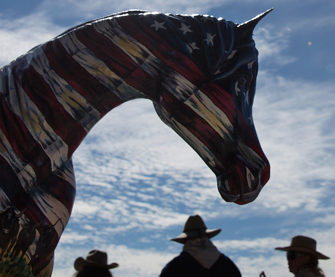 A hand-painted horse with the history of Florida and the Great - Florida Cattle Drive painted on it sits just outside the Silver Spurs - Arena. The horse, painted by Linda Ballantine Brown, was one of - the prizes in a raffle at the end of the drive.