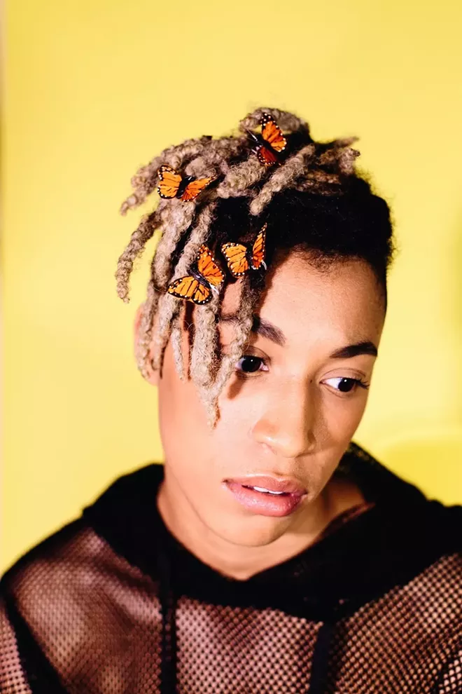 ORANGE MONARCH BUTTERFLIES ALIGHT ON FLORIDA “POP&B” ARTIST DELIA DANE’S HEAD WITH A HEALING TOUCH.PHOTO BY LIV JONSE