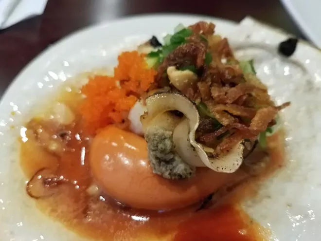 Grilled scallop with coral at Mama Lau va Oc - PHOTO BY FAIYAZ KARA
