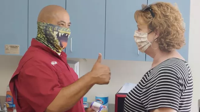 Gatorland's public safety preparedness video shows employee temperature checks - SCREENSHOT VIA GATORLAND/YOUTUBE