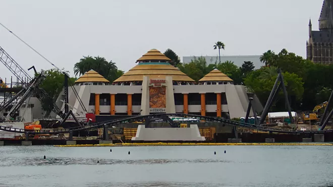 The Discovery Center with the new coaster being installed in front of it. As seen from the Port of Entry. - IMAGE VIA BIORECONSTRUCT | TWITTER