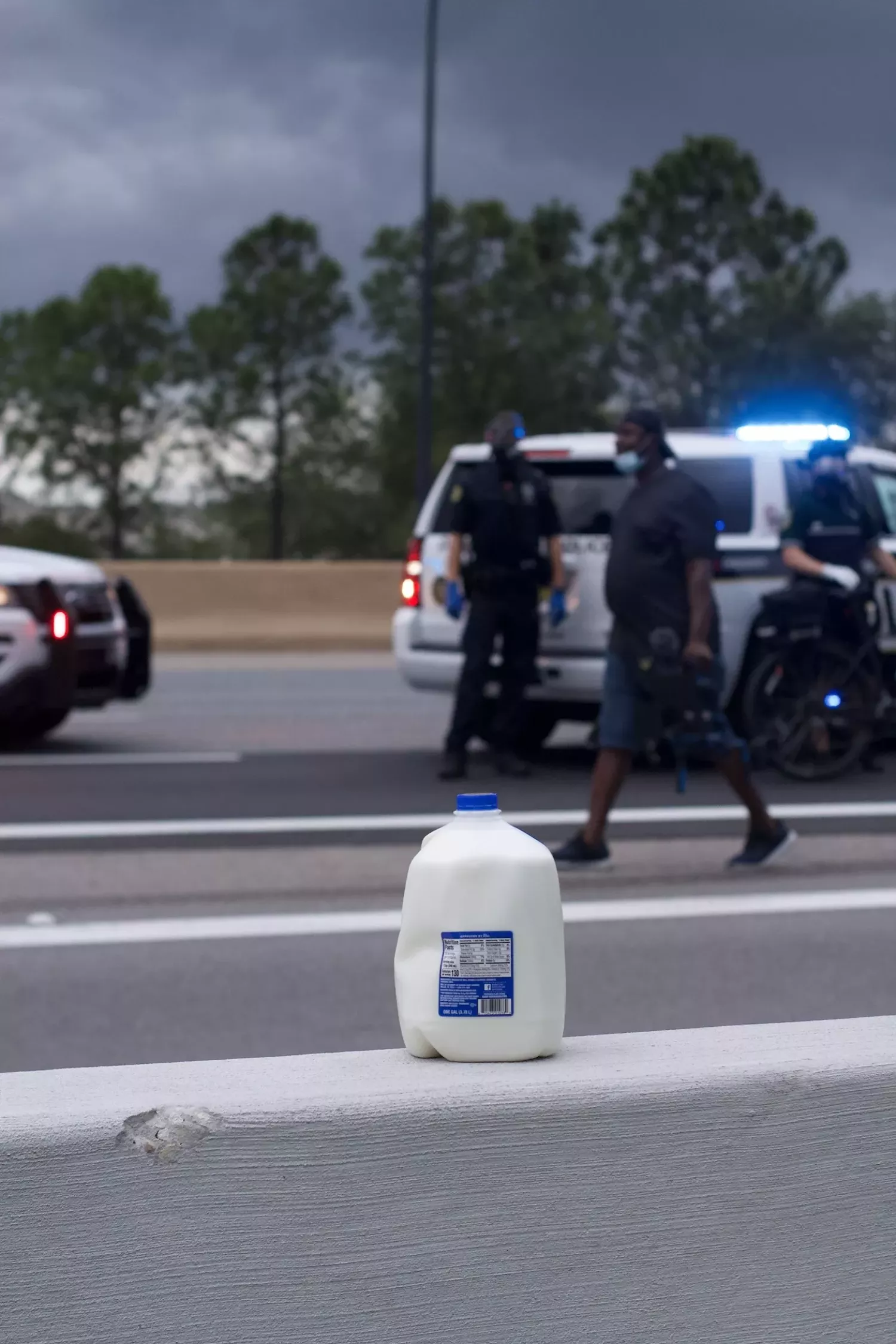 Milk soothes the burn of chemical irritants shot into the crowd by law enforcement. (Photo by Carly Kedrierski) - PHOTO BY CARLY KEDRIERSKI