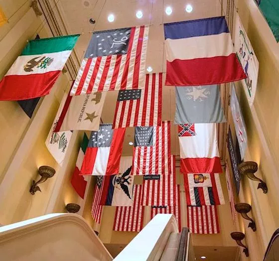 The Hall of Flags with the now-removed last official flag of the Confederate States of America (center-right). - PHOTO VIA THEME PARK INSIDER