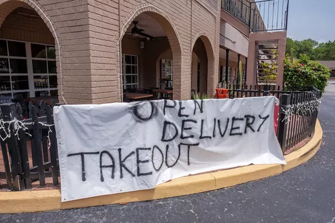Sign on a Florida restaurant advertising takeout during coronavirus stay-at-home order - PHOTO VIA ADOBE STOCK