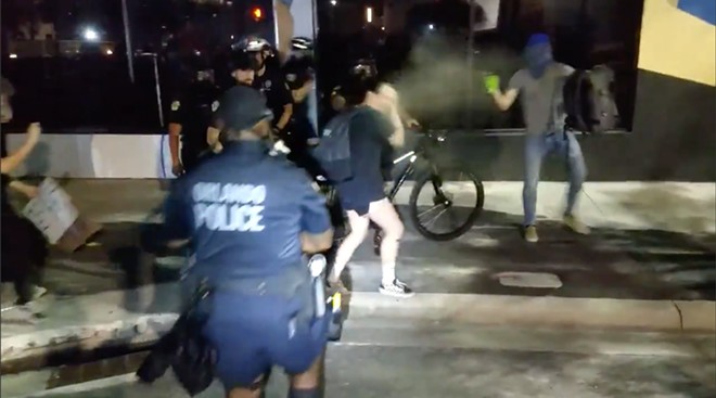 Orlando Police officers use tear gas on a protester - SCREENSHOT VIA 846POLICEBRUTALITY.COM