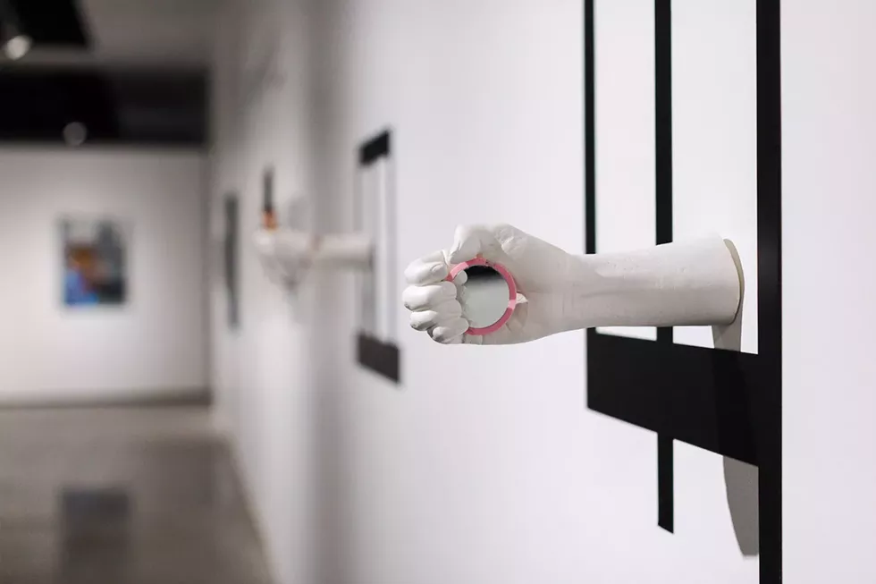 THROUGH OCT. 1: 'ILLUMINATING THE DARKNESS: OUR CARCERAL LANDSCAPE,' UCF ART GALLERY - JHAFIS QUINTERO, 'PROTESIS (CAMPANA),' 2015 IRON, DENTURE CEMENT, CORD AND POCKET MIRROR [PHOTO COURTESY UCF]