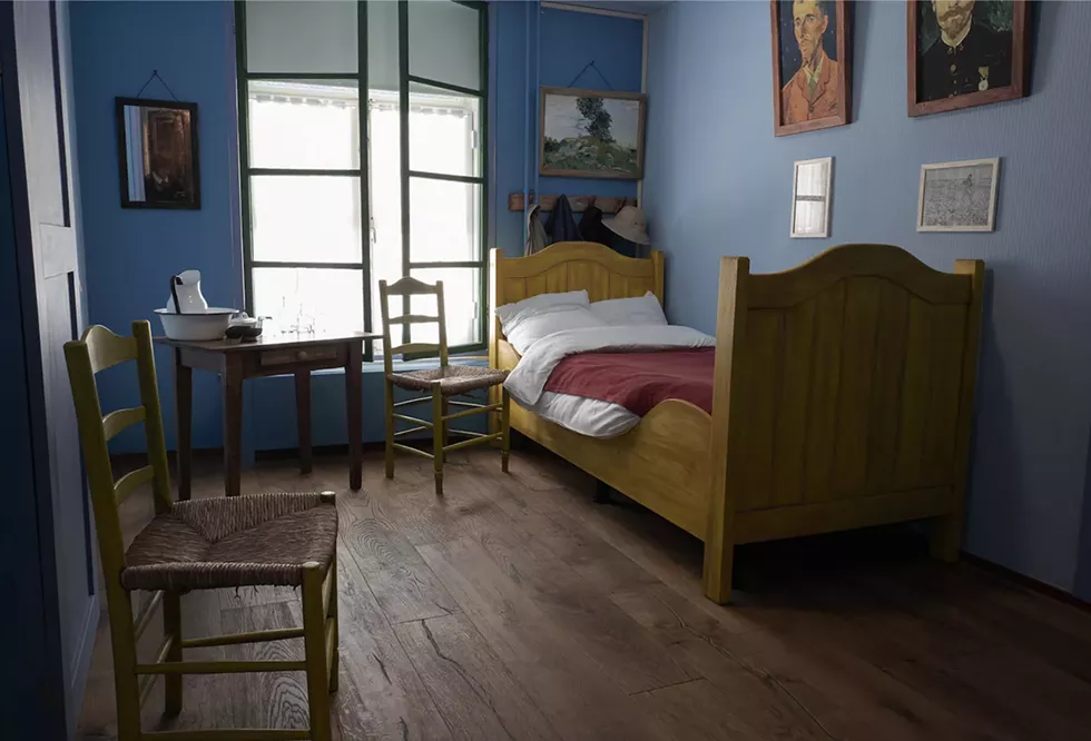 A recreation of the Arles Bedroom from the Van Gogh painting in the Hotel Riche. At the close of WWII, the original bed from Arles was donated to Boxmeer, by the Van Gogh family, to be used by local residents displaced by the war. Boxmeer, The Netherlands. - PHOTOGRAPH BY PATRICIA LANZA