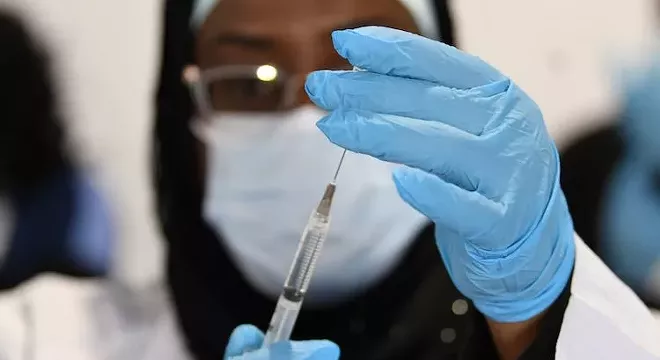 A FEMA worker prepares a COVID-19 vaccination syringe. - PHOTO COURTESY FEMA/FACEBOOK