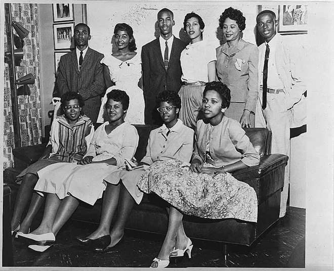 The Little Rock Nine pose for a photo. Minnijean Brown Trickey is the second person on the left on the bottom row. - PHOTO VIA CHICAGO TONIGHT