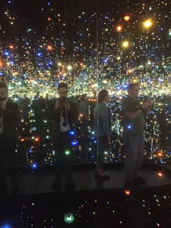 The author in Yayoi Kusama's installation 'The Souls of Millions of Light Years Away'