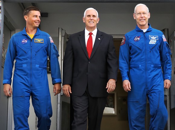 Mike Pence leaves a tour of Orion facilities at O&C High Bay with NASA astronauts Reid Wiseman (left) and Pat Forrester (right). - JOEY ROULETTE FOR ORLANDO WEEKLY
