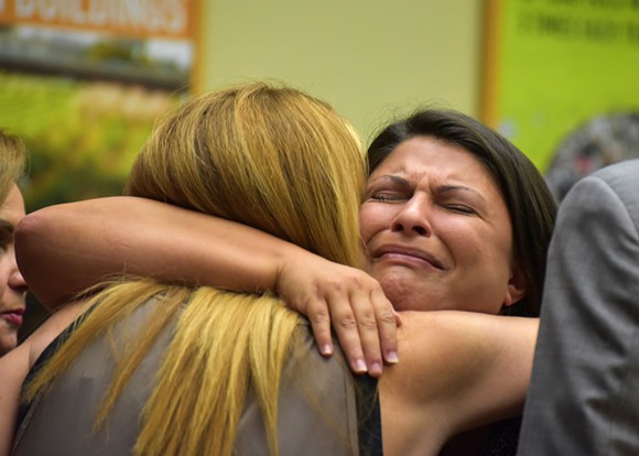 Jessica Realin hugs Pulse owner Barbara Poma. - PHOTO BY MONIVETTE CORDEIRO