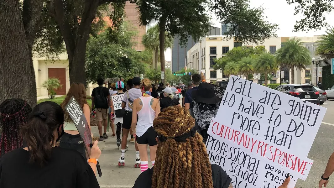The Black Artists for Black Lives march passed by the new street mural Sunday, June 28. - PHOTO BY SETH KUBERSKY