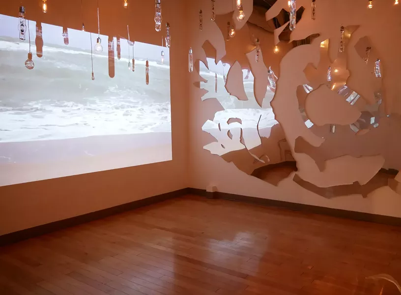 Installation view: ‘Mixing Currents’ by Mira Lehr, 2018. Dimensions variable. Halide bulbs, assorted incandescent bulbs, video, cables, wire. - IMAGE COURTESY OF THE ARTIST