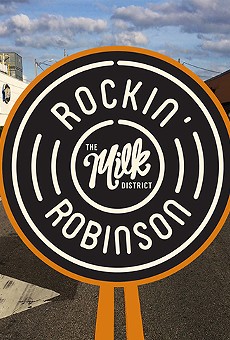Milk District sets up the barricades for Rockin' Robinson music fest this Saturday