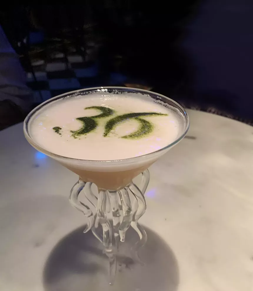 Genesis, a peach-forward delight at 36 Below, has "36" inscribed in matcha powder in the foam. - BAHAR ANOOSHAHR