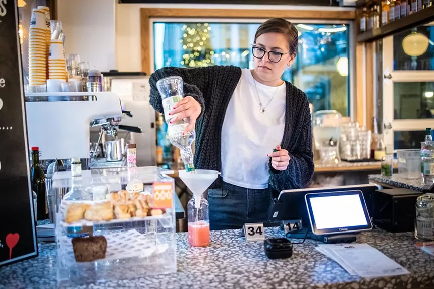 Mariah Madrid makes a batch of greyhounds to-go at the downtown Ingo’s. - JACOB TYLER DUNN