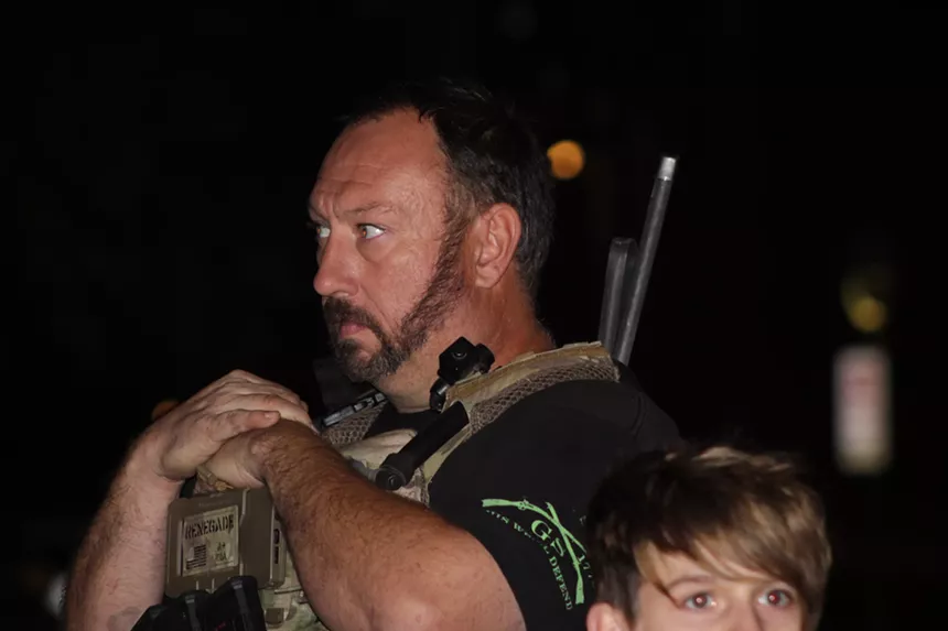 Guns and military gear were common among participants during the January 6 vigil in Phoenix. - ELIAS WEISS